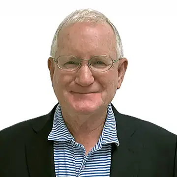 person in glasses smiling; white background