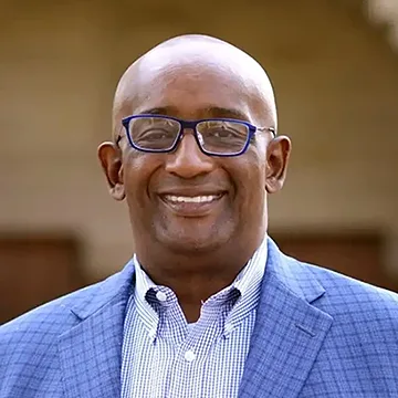 person smiling wearing blue jacket