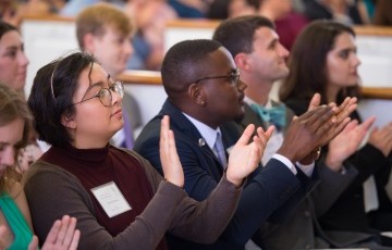 image of students clapping in an audience