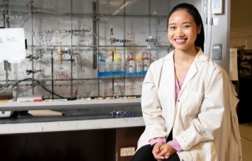 image of a student sitting in a chemistry lab