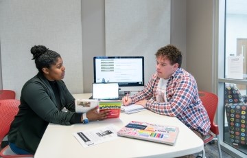 image from Writing Center of a writing consultation between a student and tutor