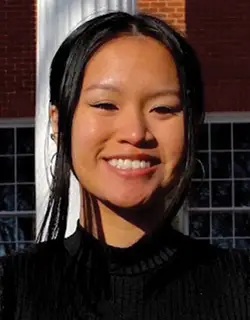 Portrait of Tina Truong in front of white building