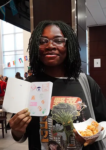 Student holding passport