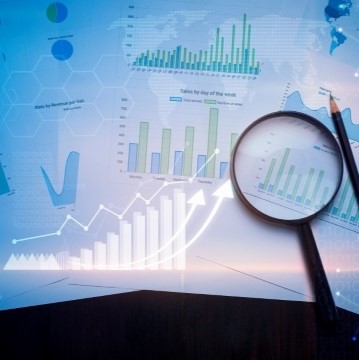 photo collage of different ways to demonstrate quantitative data, including line charts, bar charts, spreadsheets.  A magnifying glass and pencil are also in the image