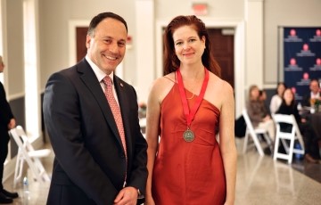 Faculty member accepting an award from the Dean