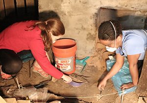 Martha Grace Mize and Kyara Williams excavate the basement of the Hughs house’s slave quarters in Holly Springs, Miss., Saturday, April 11, 2015. (DM Photo | Zoe McDonald)