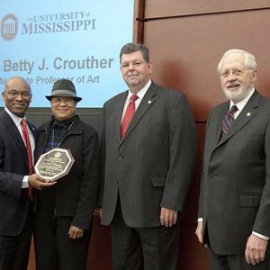 Trustee Shane Hooper, Dr. Betty J. Crouther, Associate Professor of Art, Dr. Morris Stocks, Provost, and Trustee Aubrey Patterson, President of the Board of Trustees.