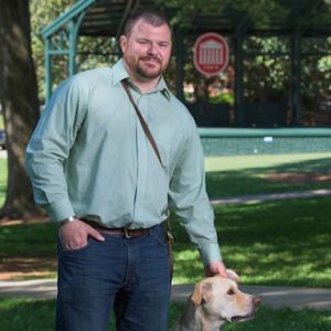 UM graduate student Ben Stepp and service dog Arliegh have attended every class together since 2014. Photo by Robert Jordan/Ole Miss Communications