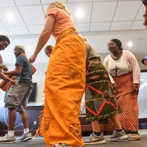 Neema Loy (left), a graduate teaching assistant from Tanzania, leads UM students in her Swahili language class in traditional Tarab dances. Photo by Robert Jordan/UM Communications