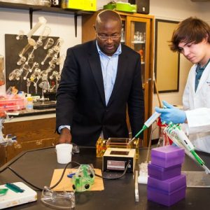 Dr. Murrell Godfrey (left), director of forensic chemistry, talks Embry scholar Lane Killough through the beginning stages of running a polymerase chain reaction (PCR). Forensic chemists use the PCR process to duplicate DNA until the sample size is large enough to analyze. The University of Mississippi has one of only five accredited forensic chemistry programs in the nation.