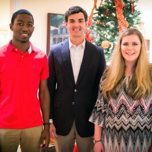 Alumnus Jimmy Carr (center) greets his 2016 scholarship recipients, Pride of the South Marching Band members James Vinson (left) and Taylor Bost (right) at Memory House.