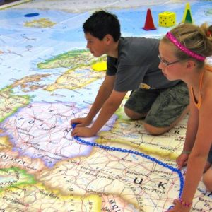 Middle school students spend some time interacting with the National Geographic Giant Map of Europe. The map is touring selected cities across Mississippi. Photo courtesy of Mississippi Geographical Association