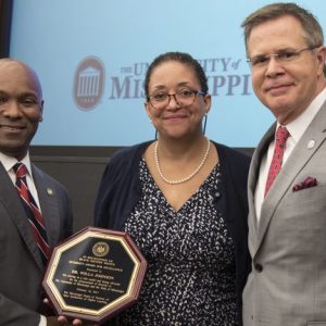 Willa Johnson (center), UM associate professor of sociology, receives the IHL Excellence in Diversity Award. She is congratulated by (from left) IHL trustee Shane Hooper and Chancellor Jeffrey Vitter. Submitted photo