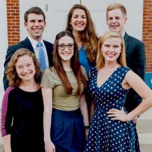 The university’s inaugural Stamps Scholars recently gathered to re-create their class photo from four years ago. They are (front, from left) Madeleine Achgill, Kate Prendergrast and Eloise Tyner, and (back, from left) Dylan Ritter, Kathryn James and Ben Branson. Photo by Bill Dabney