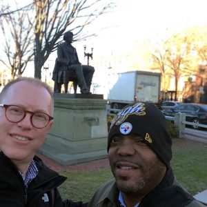 Jeff Jackson (left) and Chuck Ross (right) posing with the statue of abolitionist Senator Charles Sumner while in Cambridge, Massachusetts, for the “Universities and Slavery: Bound by History” conference at the Radcliffe Institute for Advanced Study at Harvard University. Photo by Jeffrey Jackson, March 2017.