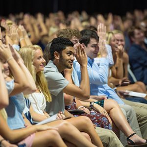 Freshmen throw up the Landshark sign during the University of Mississippi’s Fall Convocation. The university enrolled 3,697 freshmen this fall and 23,780 students overall. Photo by Kevin Bain/Ole Miss Communications