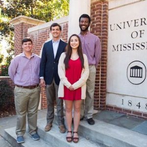 University of Mississippi alumnus Jimmy Carr of Oxford, Mississippi, second from left, greets the recipients of two scholarships he and his wife, Amanda, established to help students achieve their educational goals. Tyler Weaver, left, and Xakylan Johnson, right, both of Oxford, are the recipients of the Jimmy Carr State Farm Scholarship while Michelle Terracina of Greenville, Mississippi, received the Judy Carr Scholarship, established in honor of Carr’s mother.