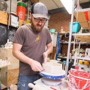 Nicholas Meyer creates ceramics in his art studio. His pieces are be on display through March 30 at Southside Gallery in the exhibit ‘Unknowns Illuminated.’ Photo by Kevin Bain/Ole Miss Communications
