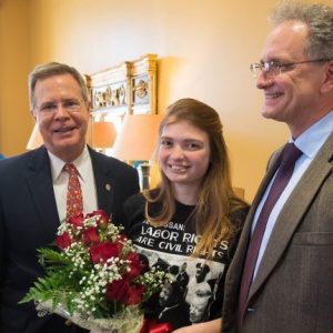 Jaz Brisack (center) is congratulated by Chancellor Jeffrey Vitter (left) and Douglass Sullivan-Gonzalez, dean of the Sally McDonnell Barksdale Honors College, on being named the university’s 15th Harry S. Truman Scholar. Photo by Kevin Bain/Ole Miss Communications