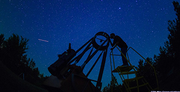 telescope against the night sky