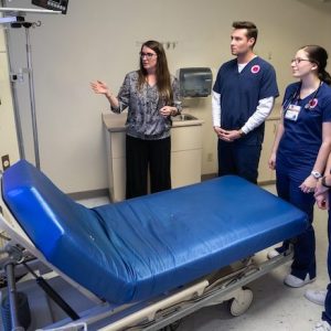 Eva Tatum (left), assistant professor in the UM School of Nursing, shows one of the future simulation labs in the former Intensive Care Unit of Baptist Memorial Hospital-North Mississippi to students Piercen Burchfield, Katelyn Hazelgrove and Charles Gill.