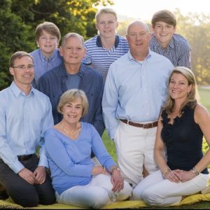 Dean Copeland (in dark blue shirt) is surrounded by family: (from left) son Braden; grandson Campbell Dickson (now 17); wife Linda; grandson Mac Dickson (now 22); son-in-law Tim Dickson; grandson Brody Dickson (now 19); and daughter Albie Dickson.