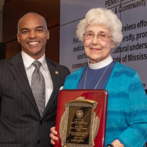 Dr. Steven Cunningham (left), chair of the IHL Diversity Committee, congratulates retired educator Peggy Sisson on being honored with the board’s Karen Cummins Community Service Award.