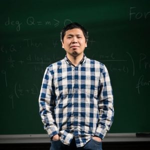 UM assistant professor of mathematics Thái Hoàng Lê holds a gold medal in International Math Olympiad, which he won as a high school student on the Vietnam team in 1999. Photo by Megan Wolfe