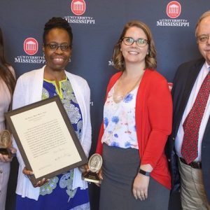 Krista Oliver (left), Karen T. Peairs, Anne Cafer and David Calder celebrate after being honored with Algernon Sydney Sullivan Awards at the 2019 Celebration of Service, hosted by the University of Mississippi Division of Diversity and Community Engagement. The annual awards, the university’s highest honor recognizing service, recognize students, faculty, staff and community members who demonstrate selfless service to others. Photo by Thomas Graning
