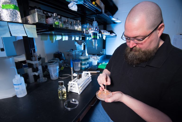 Patrick Curtis, UM associate professor of biology, recently sent samples of bacteria to the International Space Station for a study of how the organisms respond in weak gravity. Photo by Kevin Bain/Ole Miss Digital Imaging Services