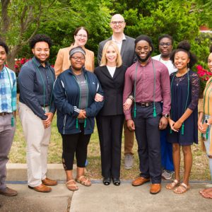Renvy Pittman and Gray Flora IV (fourth and fifth from left) are pictured with an early cohort of Grove Scholars.