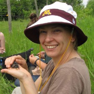 Susan Balenger, UM assistant professor of biology, holds a nestling bluebird at the the Itasca Biological Field Station in upstate Minnesota. She will discuss the decline of chirping by male crickets in Hawaii during the last Oxford Science Cafe of the fall semester.