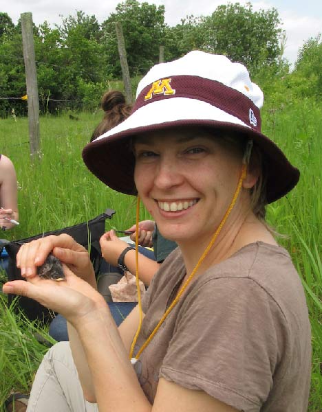 Susan Balenger, UM assistant professor of biology, holds a nestling bluebird at the the Itasca Biological Field Station in upstate Minnesota. She will discuss the decline of chirping by male crickets in Hawaii during the last Oxford Science Cafe of the fall semester. 