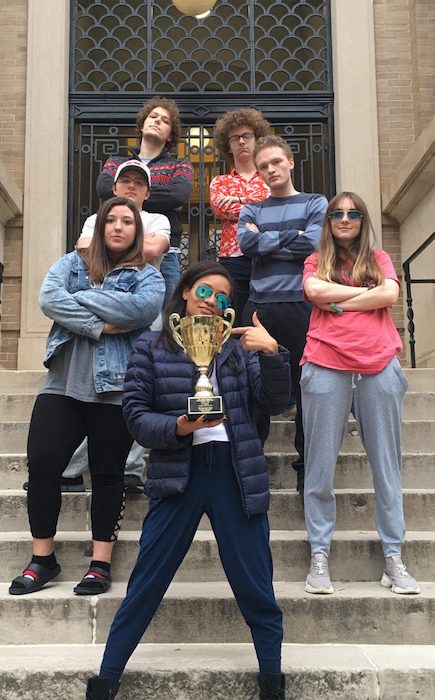 UM Ethics Bowl team members celebrate winning the Mid-Atlantic Regional Championship. Bria Mazique (front) shows off the team’s trophy with (clockwise) Alexandra Kotter, John Jacob Mabus, Justice Strickland, Jacob Ratliff, Harrison Durland and Mimi Shufelt. 