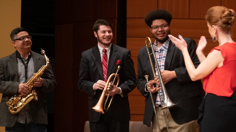 Ricky Salazar (left), a UM master’s student in music, and undergraduate music students Jesse Gibens and Quayshun Shumpert wrap up performance as part of a master class earlier this year as Nancy Maria Balach, interim chair of music, applauds. Photo by Kevin Bain/Ole Miss 