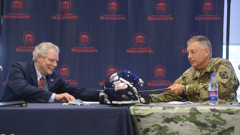  Chancellor Glenn Boyce and Maj. Gen. Jason Boyles, adjutant general of Mississippi, sign a memorandum of understanding to offer tuition assistance to National Guard members. Photo by Thomas Graning/Ole Miss Digital Imaging Services