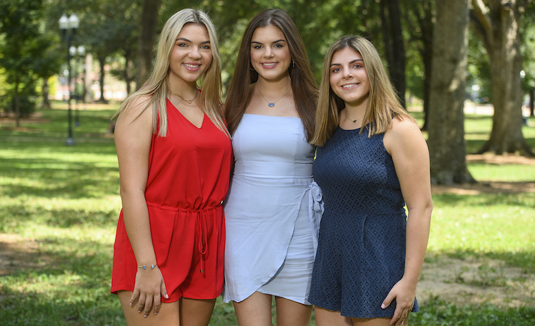 UM Honors College freshmen (from left) Amelia, Juliana and Alexandra Ladner spend time together in the Grove. The triplets say they’ve known all their lives that they would attend Ole Miss, and they’re enjoying the adjustment to college life. Photo by Thomas Graning/Ole Miss Digital Imaging Services