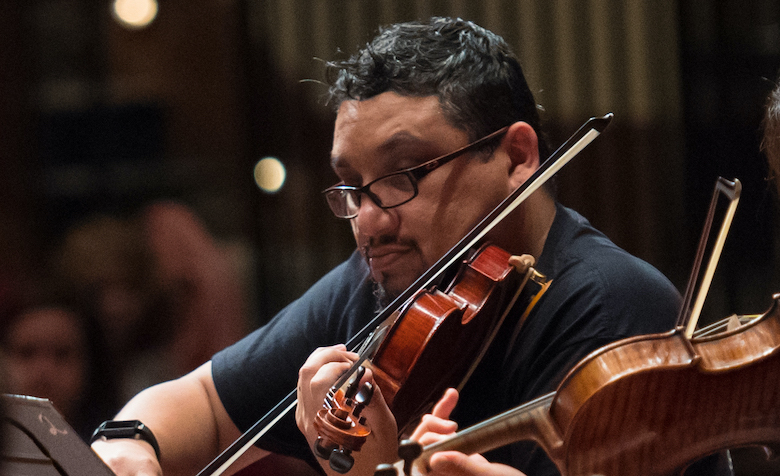 Archive Photo: Violinist Alex Urbina, a UM doctoral student in music education, performs with the LOU Symphony Orchestra in 2018. Photo by Kevin Bain/Ole Miss Digital Imaging Services