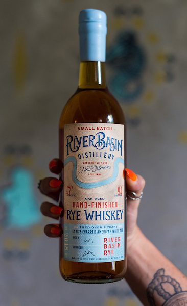 Tyler Barnes’ label design for the New Orleans-based River Basin Distillery features a map of 18th century New Orleans, a sweep of blue representing the Mississippi River and a crescent moon that cradles the French Quarter. Submitted photo