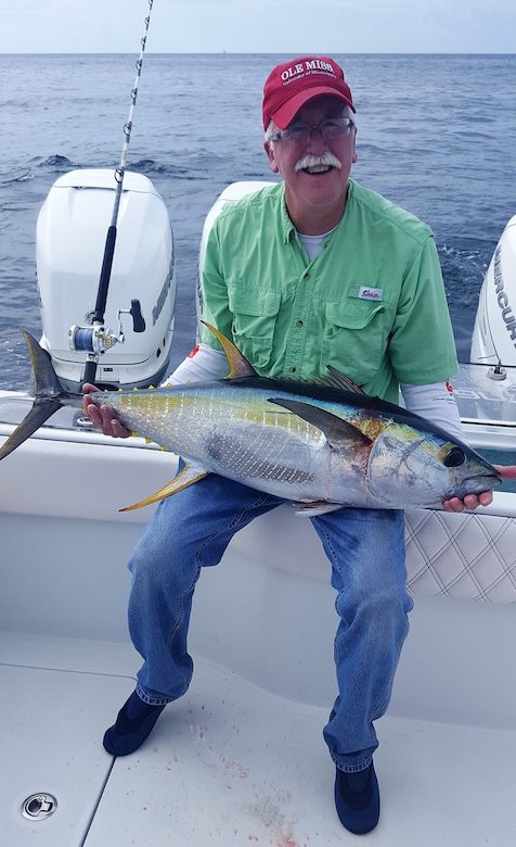 UM biologist Glenn Parsons shows off a tuna caught in the Gulf of Mexico. Parsons is a co-principal investigator on the Mobile App for Marine Assessment project. Submitted photo