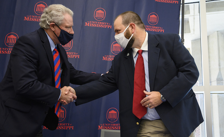 Chancellor Glenn Boyce (left) and Ecru Mayor Jeff Smith shake hands after signing M Partner agreements on Friday (Jan. 22). Photo by Thomas Graning/Ole Miss Digital Imaging Services
