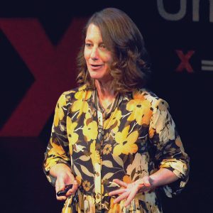 Carolyn Friewald onstage giving her TED Talk