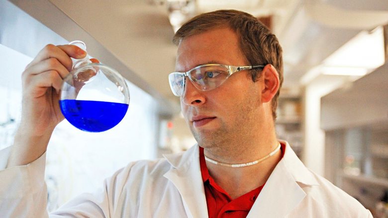 Jared Delcamp, an associate professor of chemistry and biochemistry in the lab