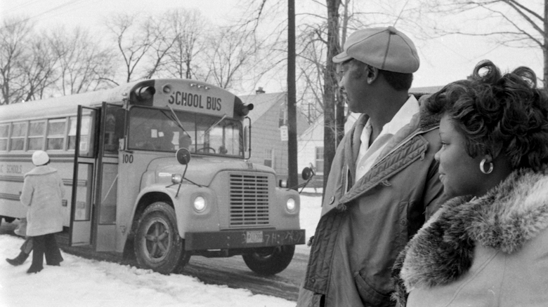 Black parents watch their children board a school bus in a vintage photo provided by Zoë Burkholder, who is set to discuss Black struggles for school integration in the North and how these struggles differed from those in the South for a Nov. 15 SouthTalk presentation.
