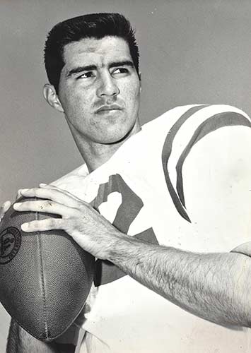 Jim Weatherly holding football