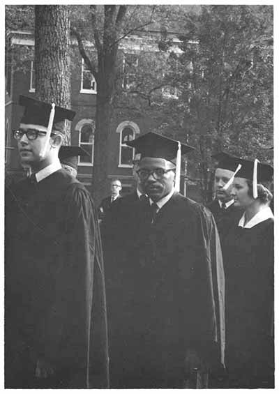 James Meredith in cap and gown at UM graduation.