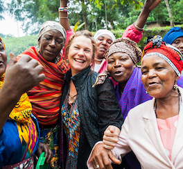 Psychology professor Laura Johnson (center) has a long history of working with the Jane Goodall Institute, where she has participated in projects that used photography and community mapping to raise awareness and spur community action. Photo courtesy Cady Herring