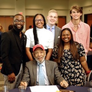 1. James Meredith (seated) with finalists for the first University of Mississippi College of Liberal Arts James Meredith Changemaker Award at the Honoring Diversity Excellence Celebration on April 11, 2023, in the Student Union Ballroom: Bobby Hudson (from left), Faith Deering, Logan Thomas, Jack Meadows, Morgan Yhap. Not pictured are Andy Flores, Reinhard Knerr, and Arquvas Williams. Photo by Tenola Plaxico of Articulate Photography