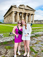Emmie Burgess (right) tours the ruins of ancient Greek temples in Paestum, Italy.