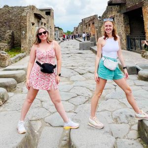 Emmie Burgess (right) and a friend explore the ancient Italian city of Pompeii, much of which was buried under volcanic ash following the eruption of Mount Vesuvius in 79 AD.